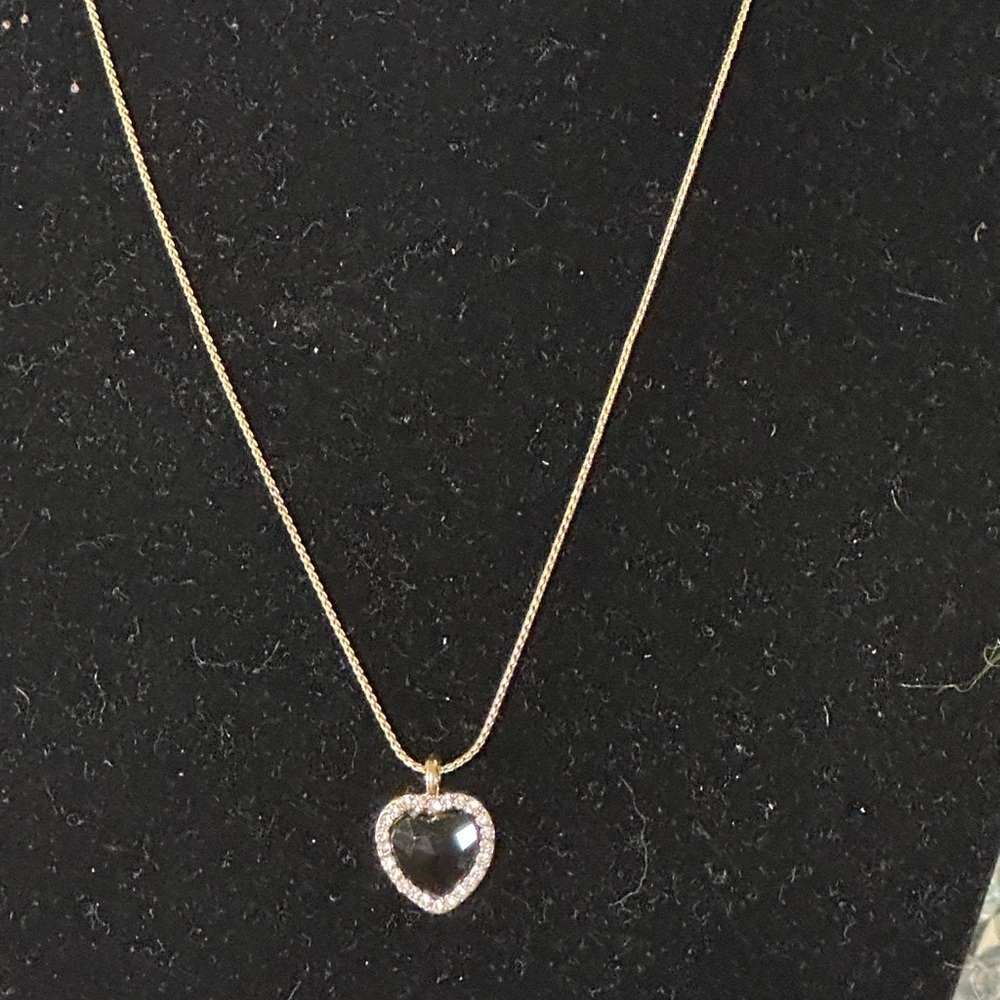 NWOT Gold Toned Necklace With Black Heart Pendant.